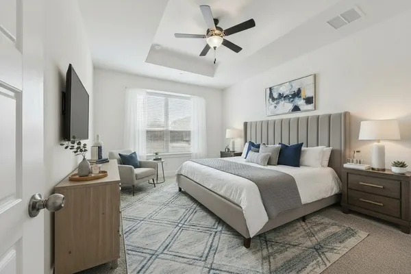 a bed room with a bed and a couch