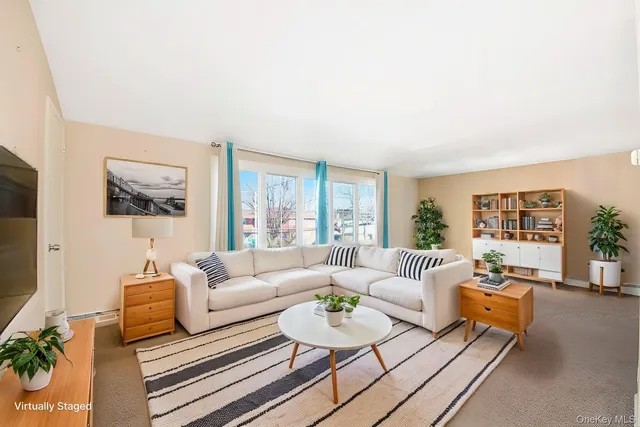 an empty room with a fireplace and window