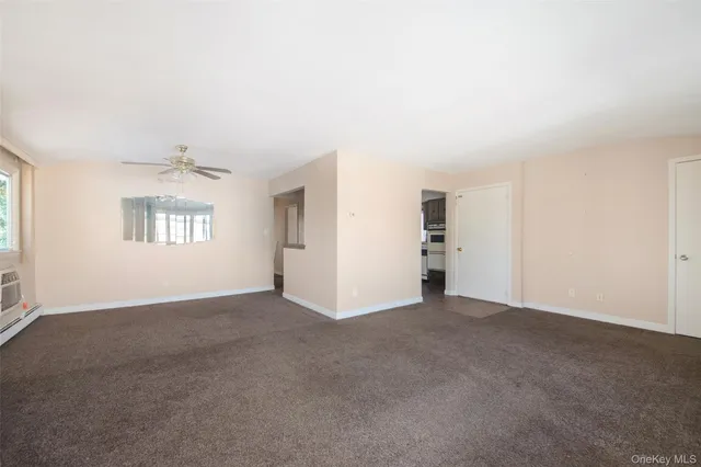 a kitchen with a sink a refrigerator and a window