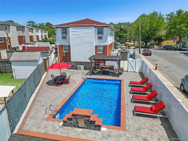 a view of a street with cars parked