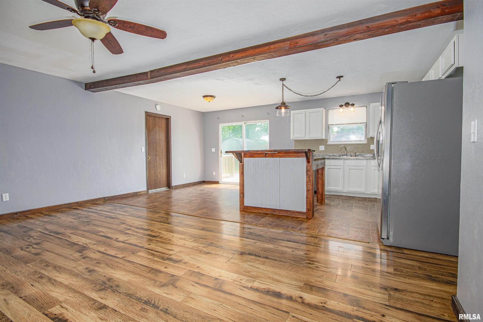 518 Roddy Road Salem, IL 62881 - Photo 6 of 24 a view of a kitchen with wooden floor and a window