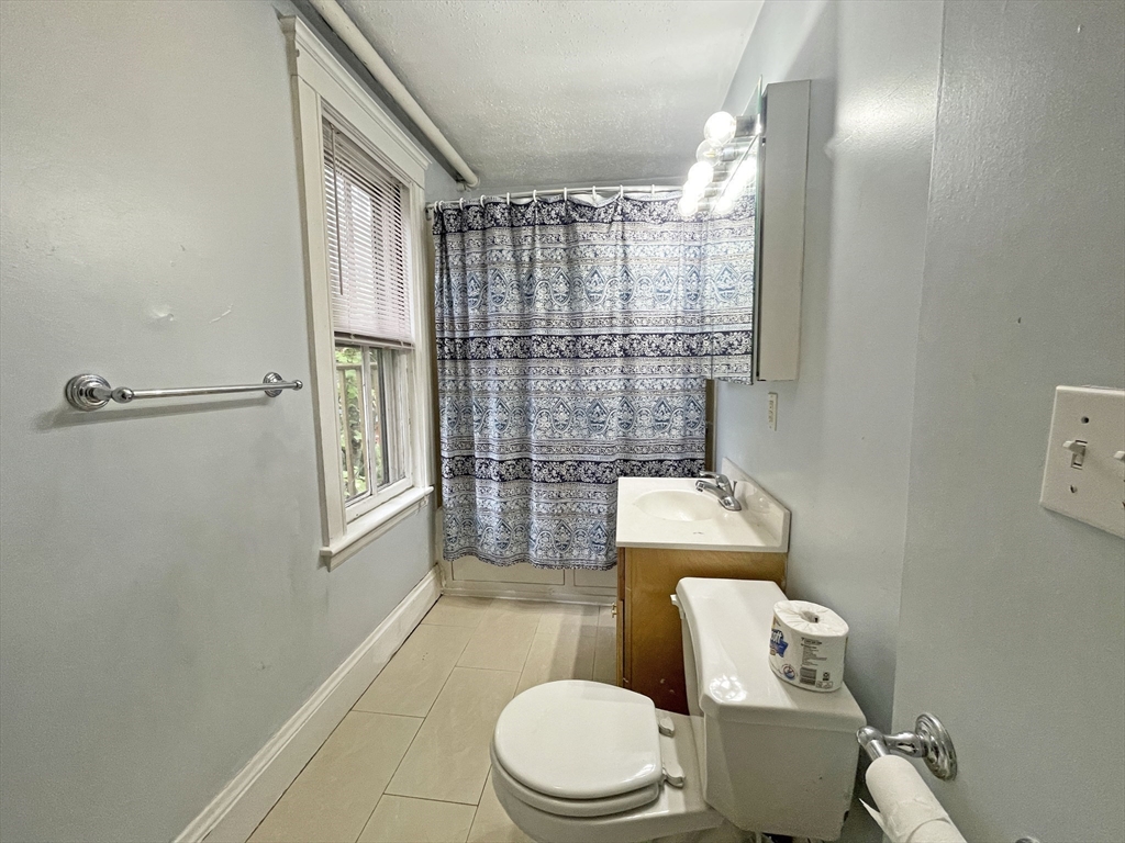 399 Newtonville Avenue, Unit 2 Newton, MA 02460 - Photo 15 of 24 a bathroom with a toilet and a shower