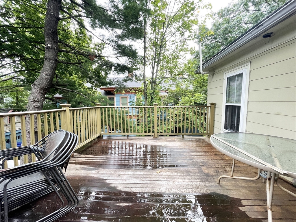 399 Newtonville Avenue, Unit 2 Newton, MA 02460 - Photo 23 of 24 a view of balcony with wooden floor and outdoor seating