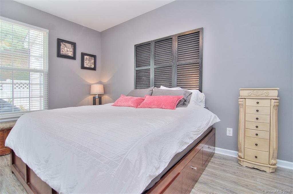738 Shellstone Place, Unit 738 Fort Mill, SC 29708 - Photo 14 of 22 a bed sitting in a bedroom next to a window