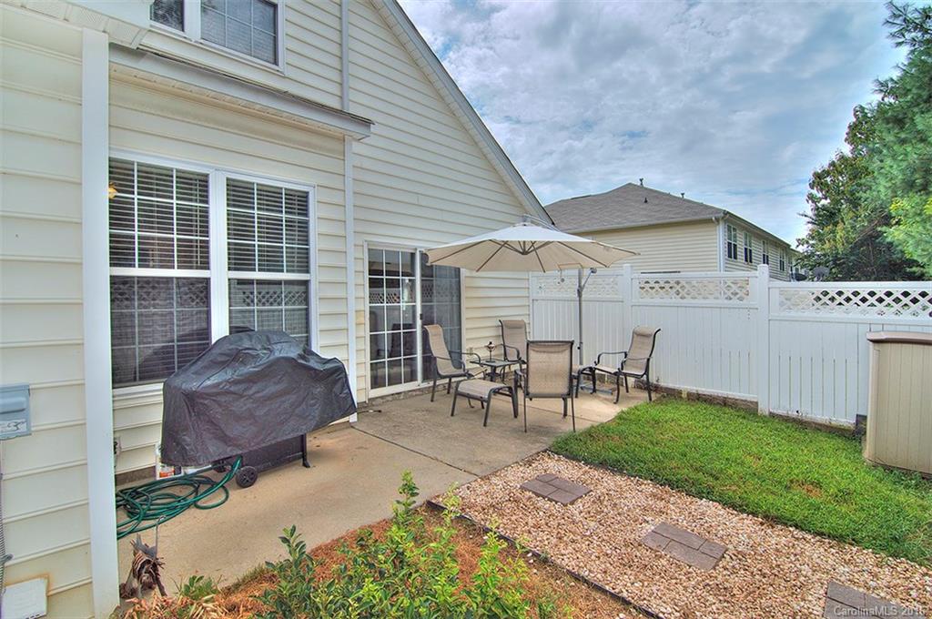 738 Shellstone Place, Unit 738 Fort Mill, SC 29708 - Photo 22 of 22 a view of a chair and table in backyard of the house