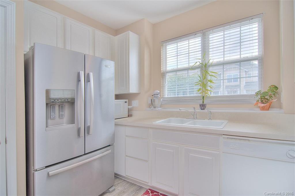 738 Shellstone Place, Unit 738 Fort Mill, SC 29708 - Photo 8 of 22 a kitchen with stainless steel appliances a refrigerator sink and cabinets