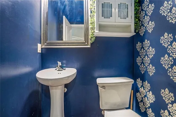 a view of a livingroom with wooden floor and closet area