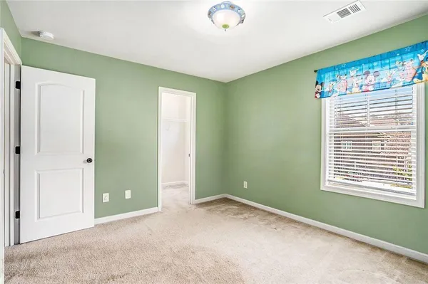 a bedroom with bed and a fireplace