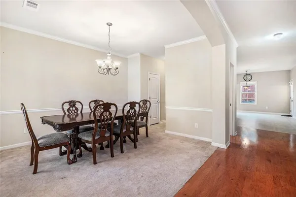 a view of a dining room with furniture