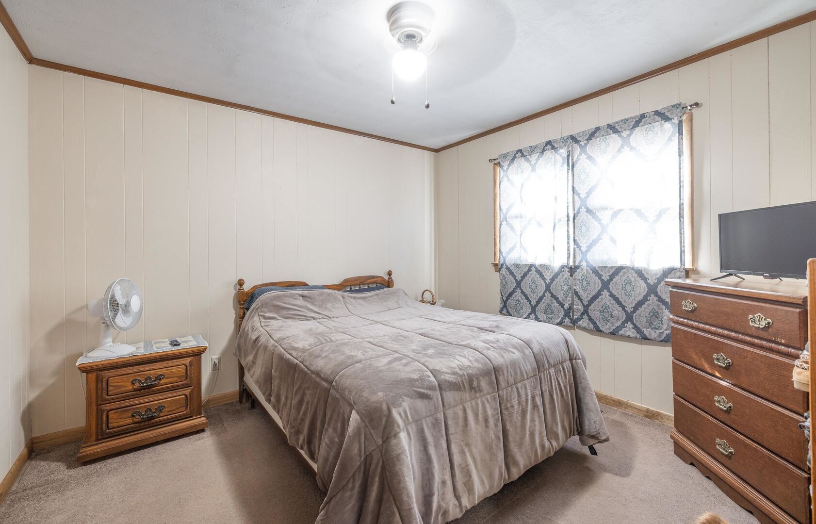 1740 Brier Creek Road, Unit 1 Harrisburg, IL 62946 - Photo 23 of 52 a bedroom with a bed and a flat tv screen on dresser