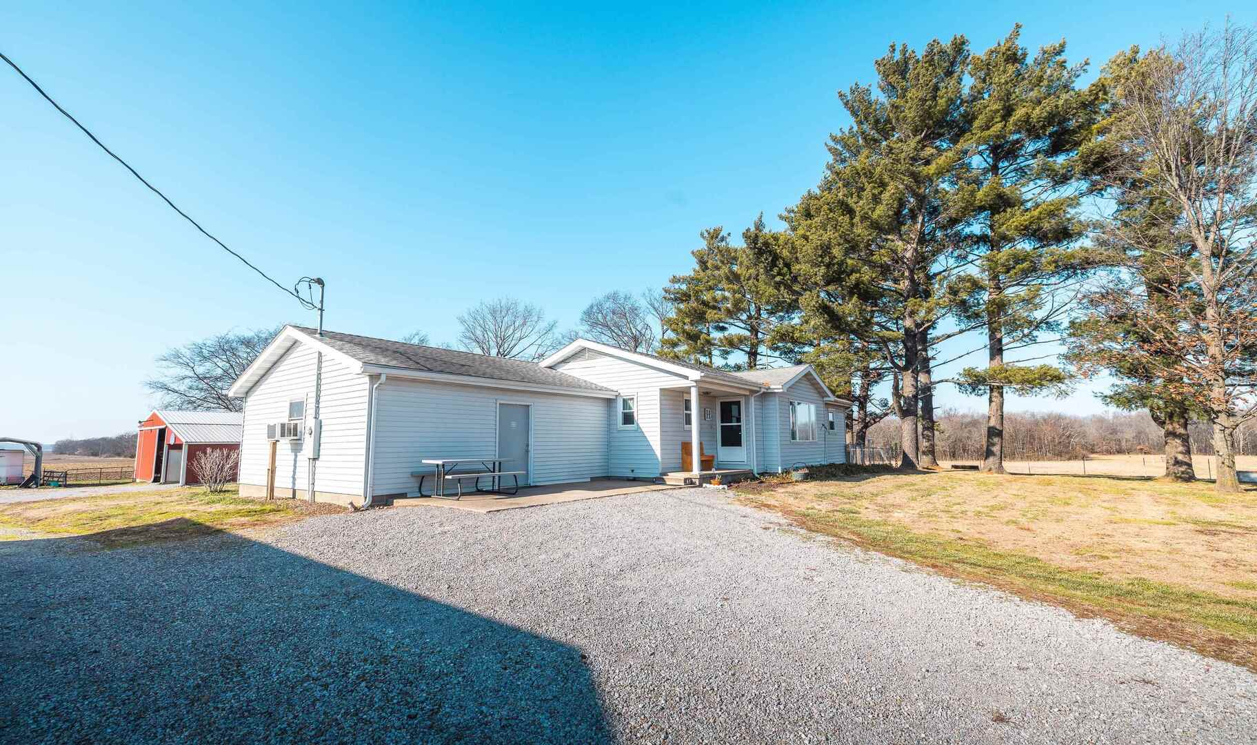 1740 Brier Creek Road, Unit 1 Harrisburg, IL 62946 - Photo 6 of 52 a front view of building with yard and trees in the background