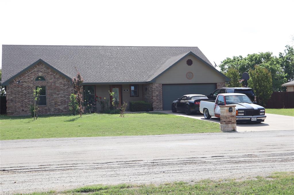 902 El Campo Drive Rio Vista, TX 76093 - Photo 1 of 1 Single story home with brick siding, driveway, and a front yard
