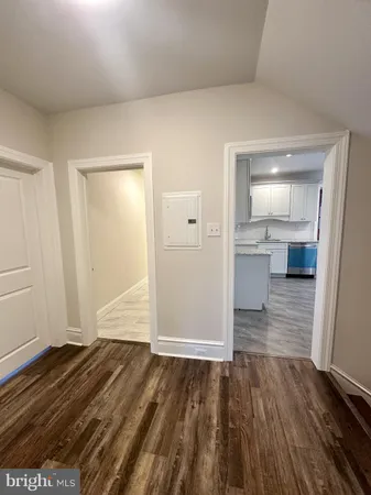 a view of hallway with wooden floor