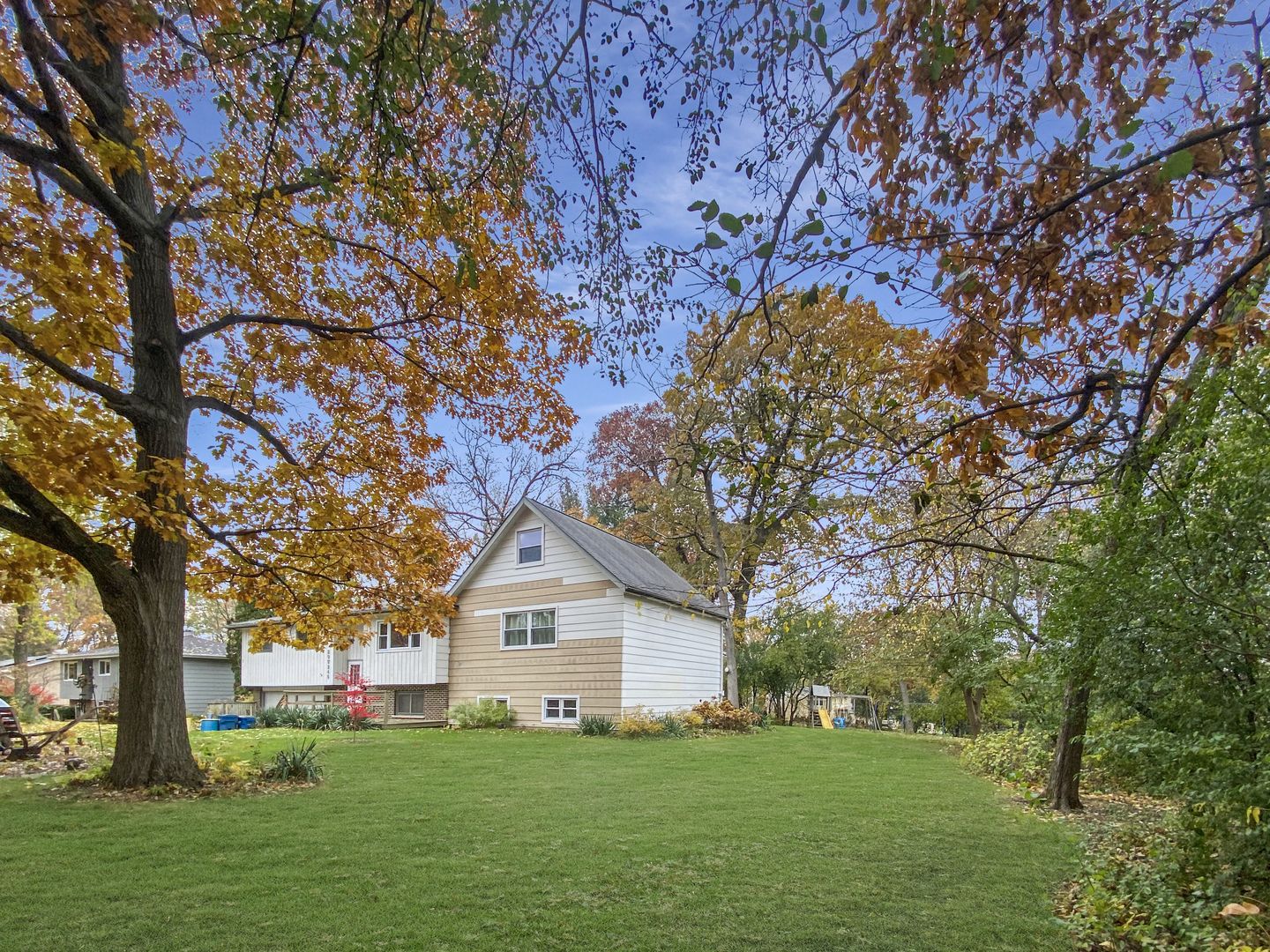 29W246 Lee Road West Chicago, IL 60185 - Photo 19 of 21 a front view of a house with a yard