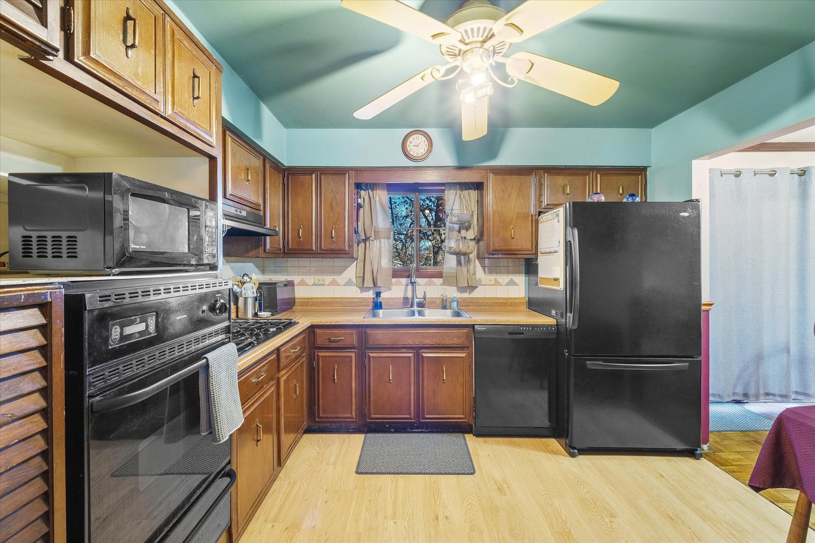 29W246 Lee Road West Chicago, IL 60185 - Photo 5 of 21 a kitchen with stainless steel appliances granite countertop a refrigerator a sink dishwasher a stove and a dining table with wooden floor