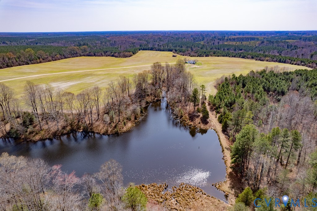 32082 Sparta Road Milford, VA 22514 - Photo 7 of 39 a view of a lake with houses in the back