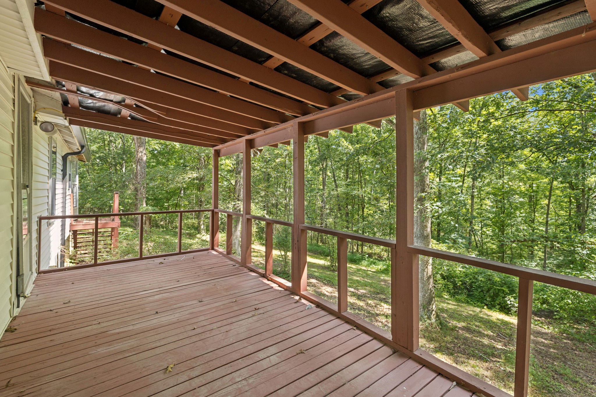 61 Brazzle Road Waverly, TN 37185 - Photo 27 of 36 a view of porch with wooden floor in outdoor space