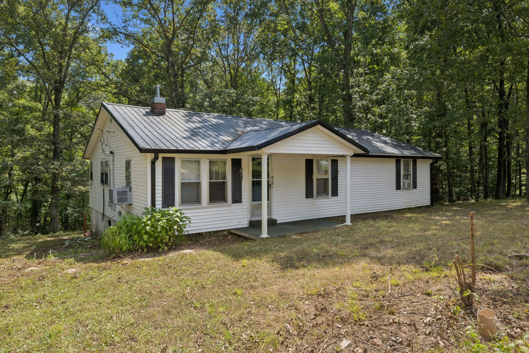 61 Brazzle Road Waverly, TN 37185 - Photo 3 of 36 a house that has a tree in front of it