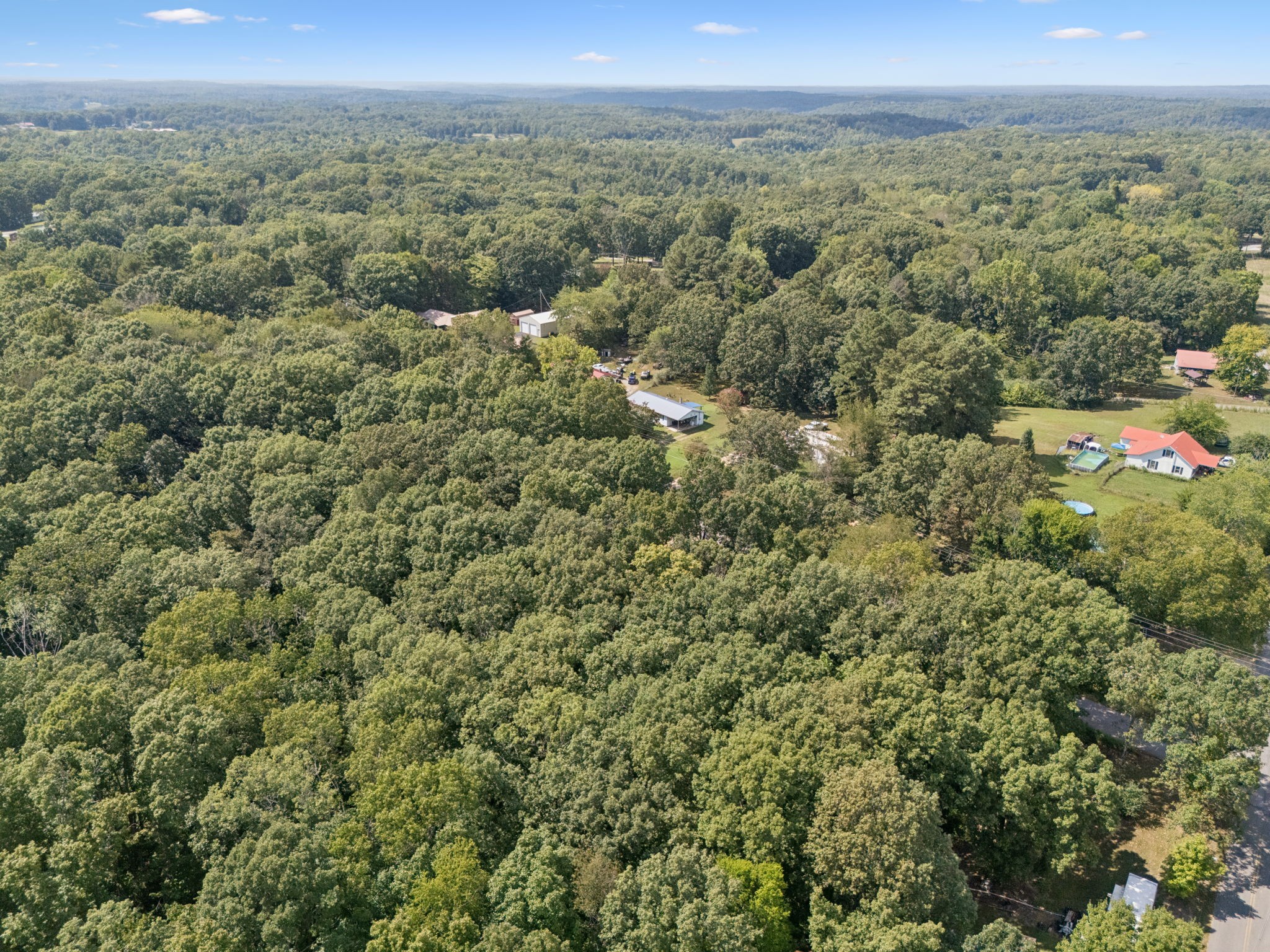 61 Brazzle Road Waverly, TN 37185 - Photo 35 of 36 a view of a city with lush green forest