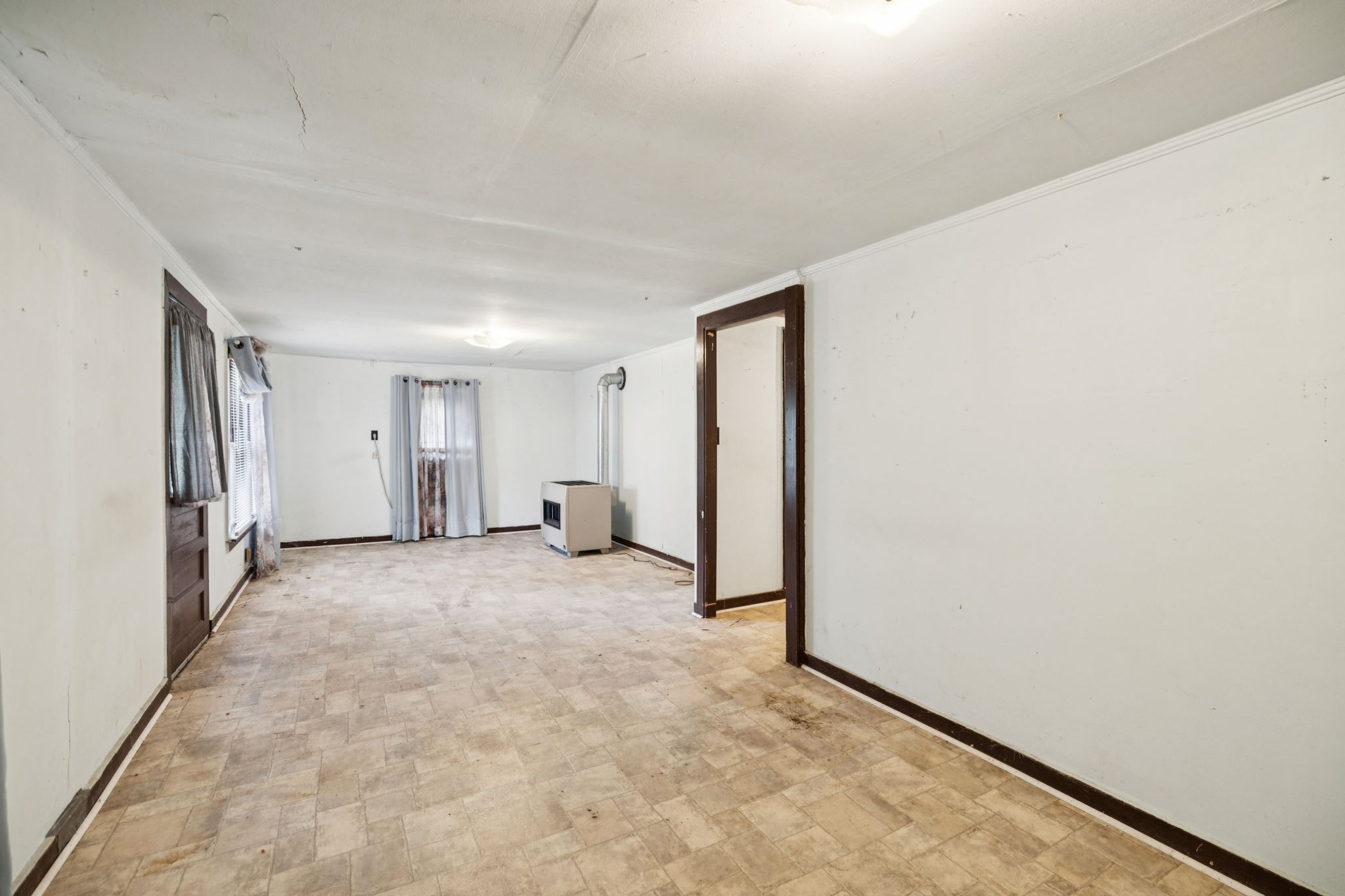 61 Brazzle Road Waverly, TN 37185 - Photo 7 of 36 a view of a livingroom with an empty space and a window