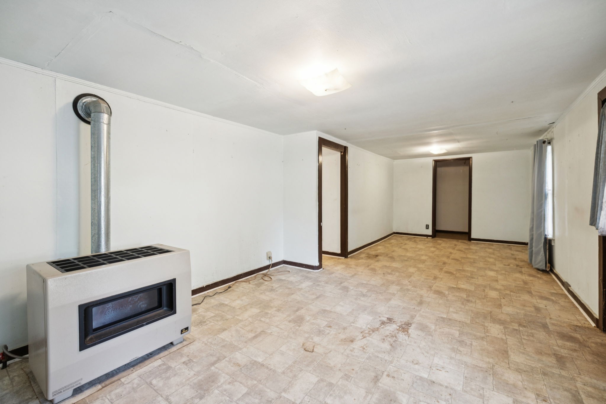61 Brazzle Road Waverly, TN 37185 - Photo 8 of 36 a view of an empty room with closet and a fireplace