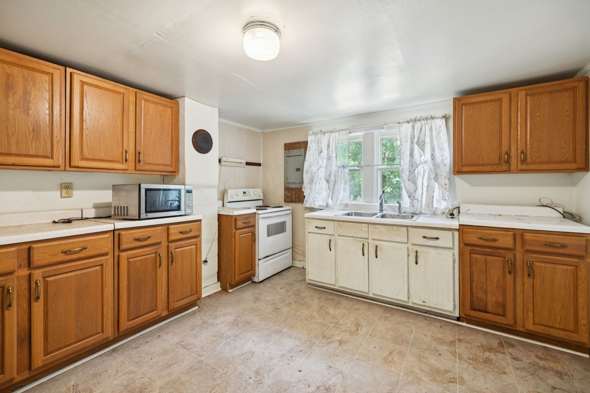 61 Brazzle Road Waverly, TN 37185 - Photo 9 of 36 a kitchen with sink cabinets and window