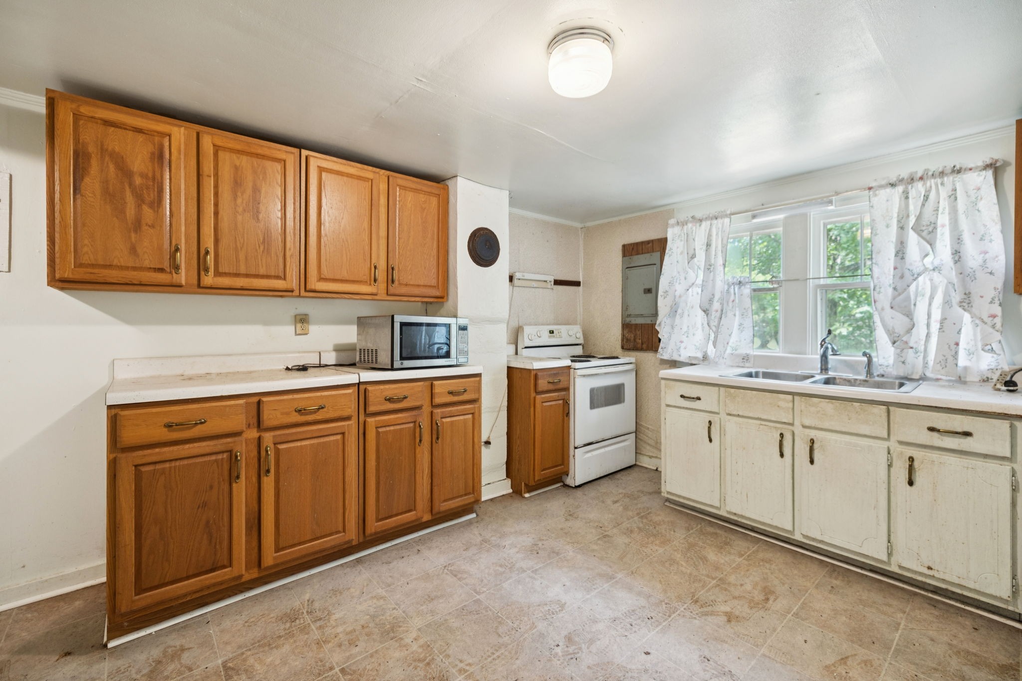 61 Brazzle Road Waverly, TN 37185 - Photo 10 of 36 a kitchen with sink cabinets and window