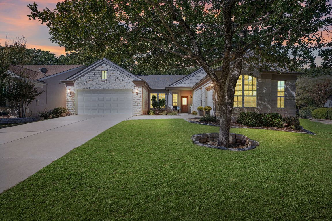 207 Cider Orchard Cove Georgetown, TX 78633 - Photo 1 of 35 a front view of a house with a yard and trees