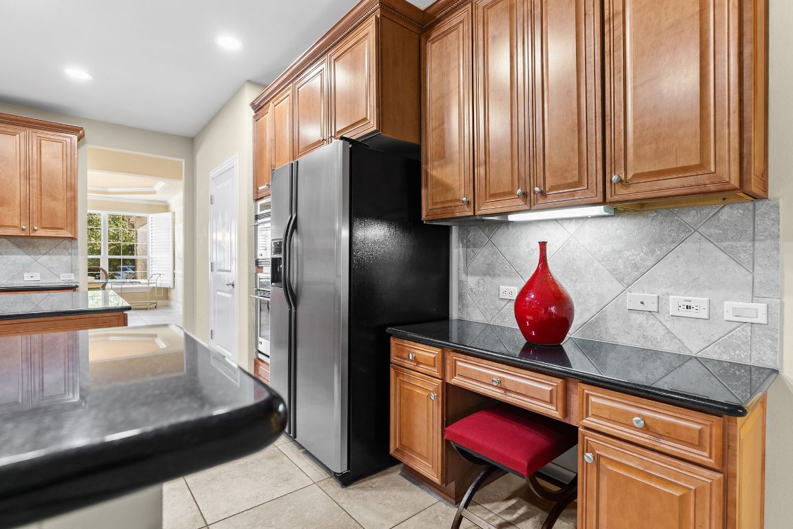 207 Cider Orchard Cove Georgetown, TX 78633 - Photo 12 of 35 a kitchen with stainless steel appliances a refrigerator and a sink