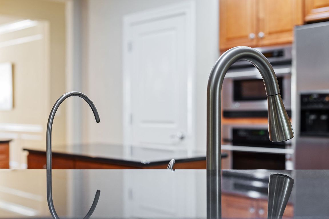 207 Cider Orchard Cove Georgetown, TX 78633 - Photo 17 of 35 a close view of dining room with a sink and a window