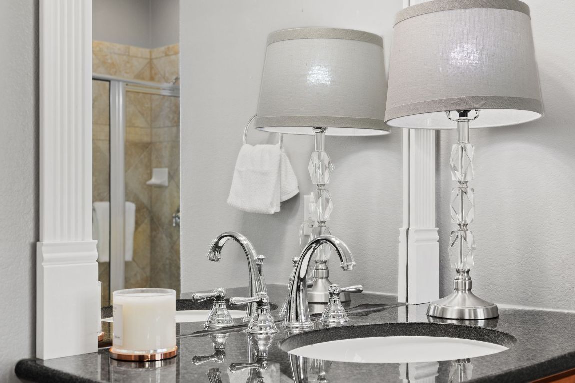 207 Cider Orchard Cove Georgetown, TX 78633 - Photo 25 of 35 a bathroom with a double vanity sink and a mirror