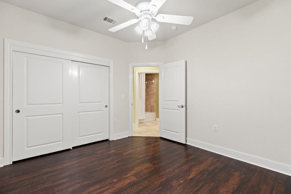 207 Cider Orchard Cove Georgetown, TX 78633 - Photo 29 of 35 a view of an empty room with wooden floor