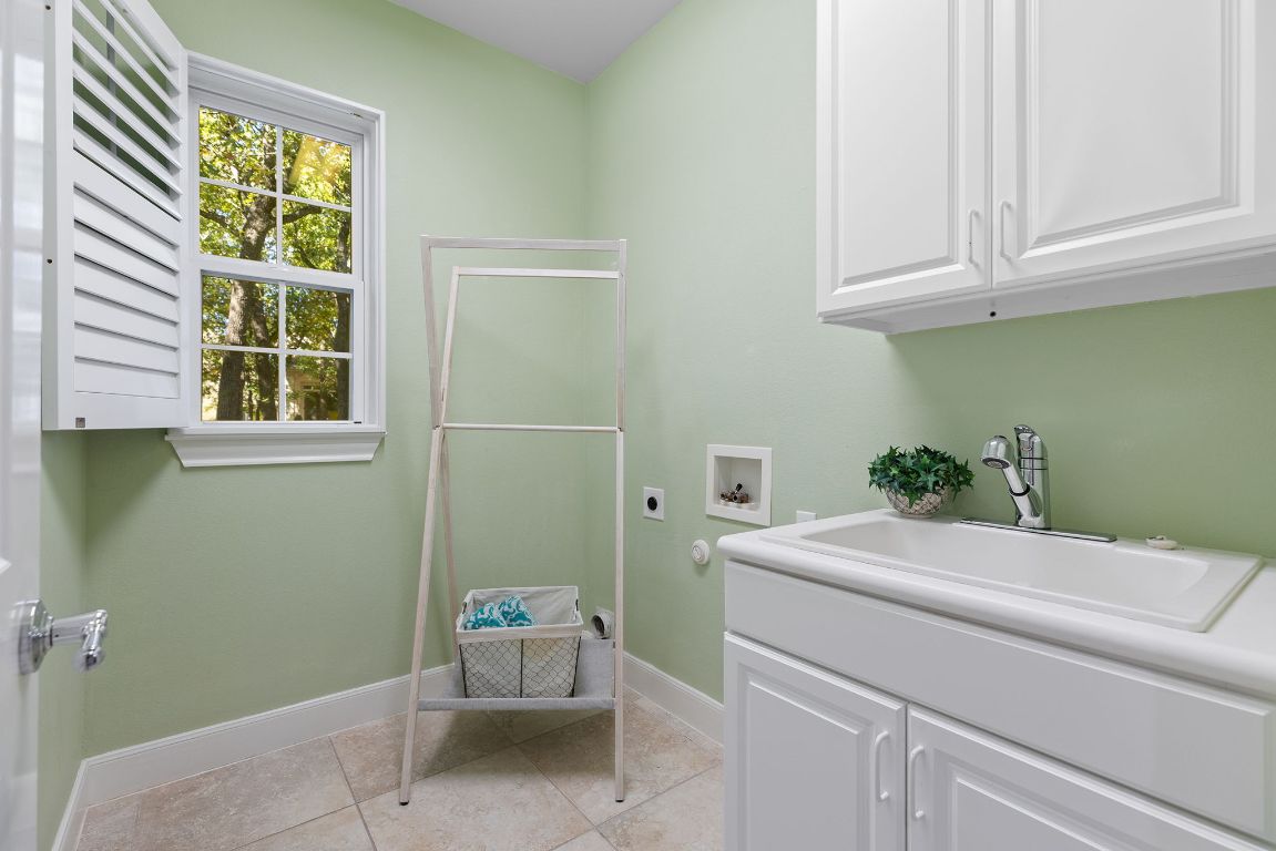 207 Cider Orchard Cove Georgetown, TX 78633 - Photo 31 of 35 a utility room with dryer and washer