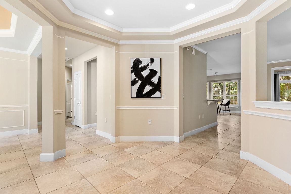 207 Cider Orchard Cove Georgetown, TX 78633 - Photo 7 of 35 a view of a hallway with wooden floor and windows