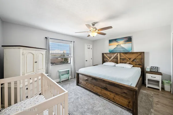 a bedroom with a bed and a table in it