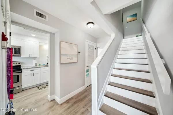 a view of entryway and kitchen