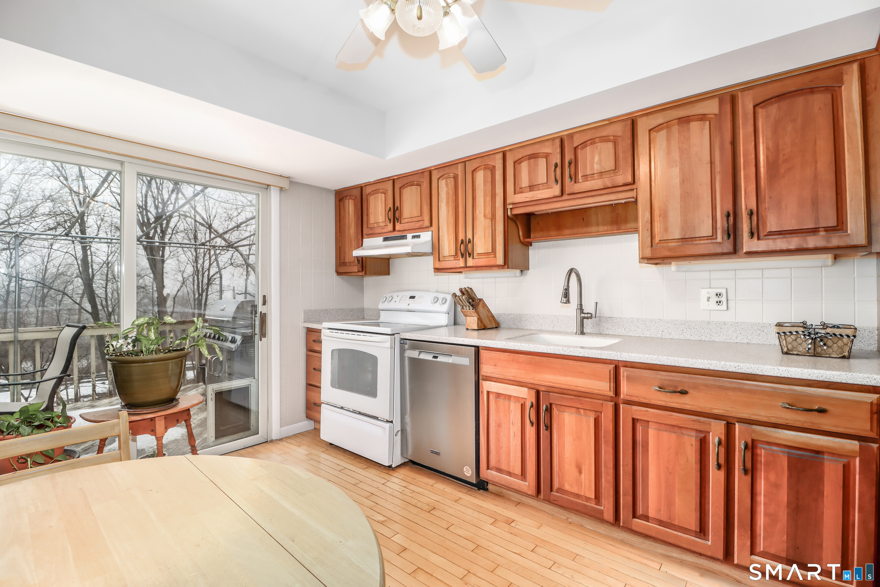 24 Prospect Drive Brookfield, CT 06804 - Photo 11 of 35 a kitchen with stainless steel appliances granite countertop a stove top oven a sink dishwasher and cabinets with wooden floor