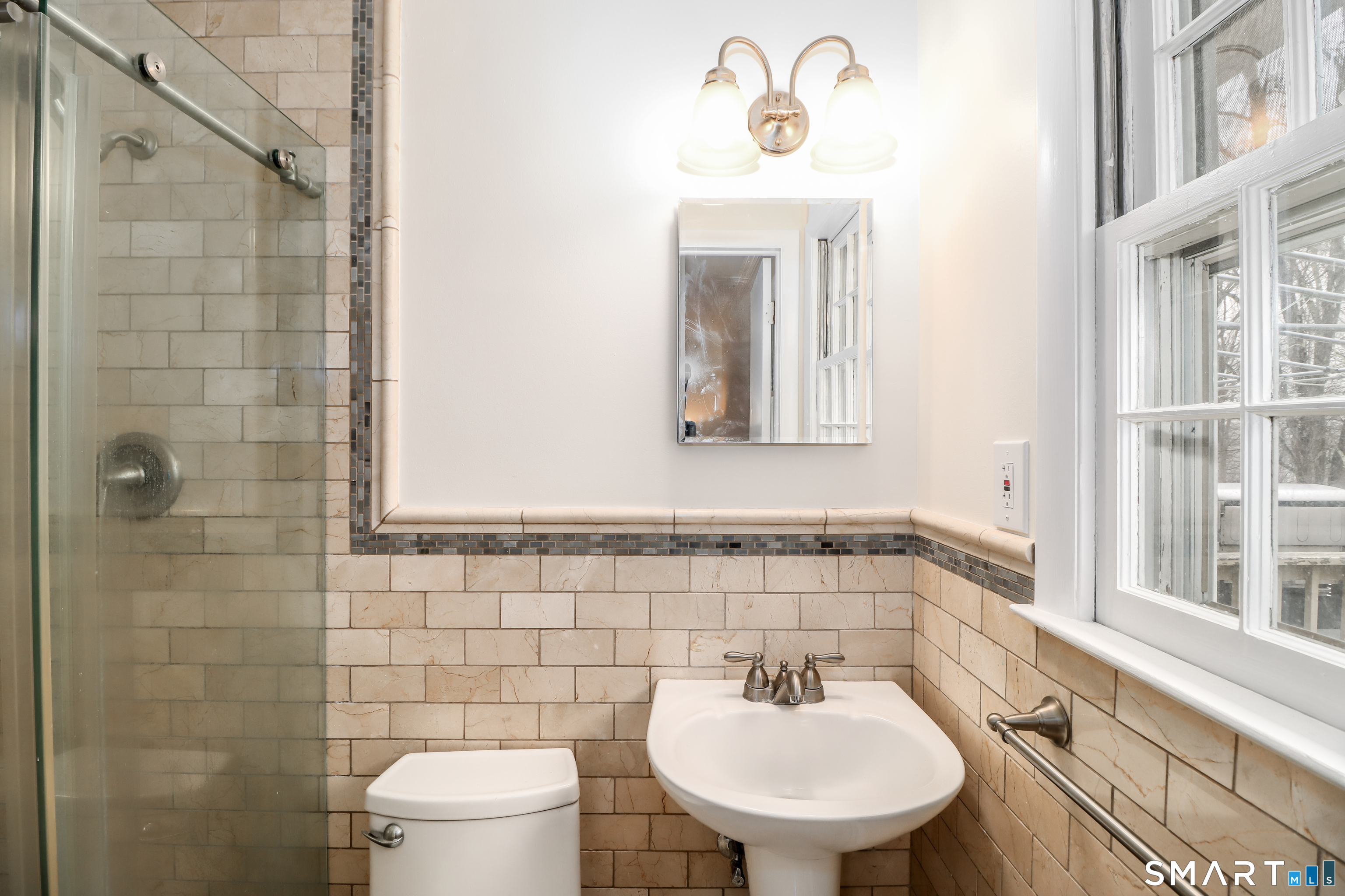 24 Prospect Drive Brookfield, CT 06804 - Photo 16 of 35 a bathroom with a sink a toilet and mirror