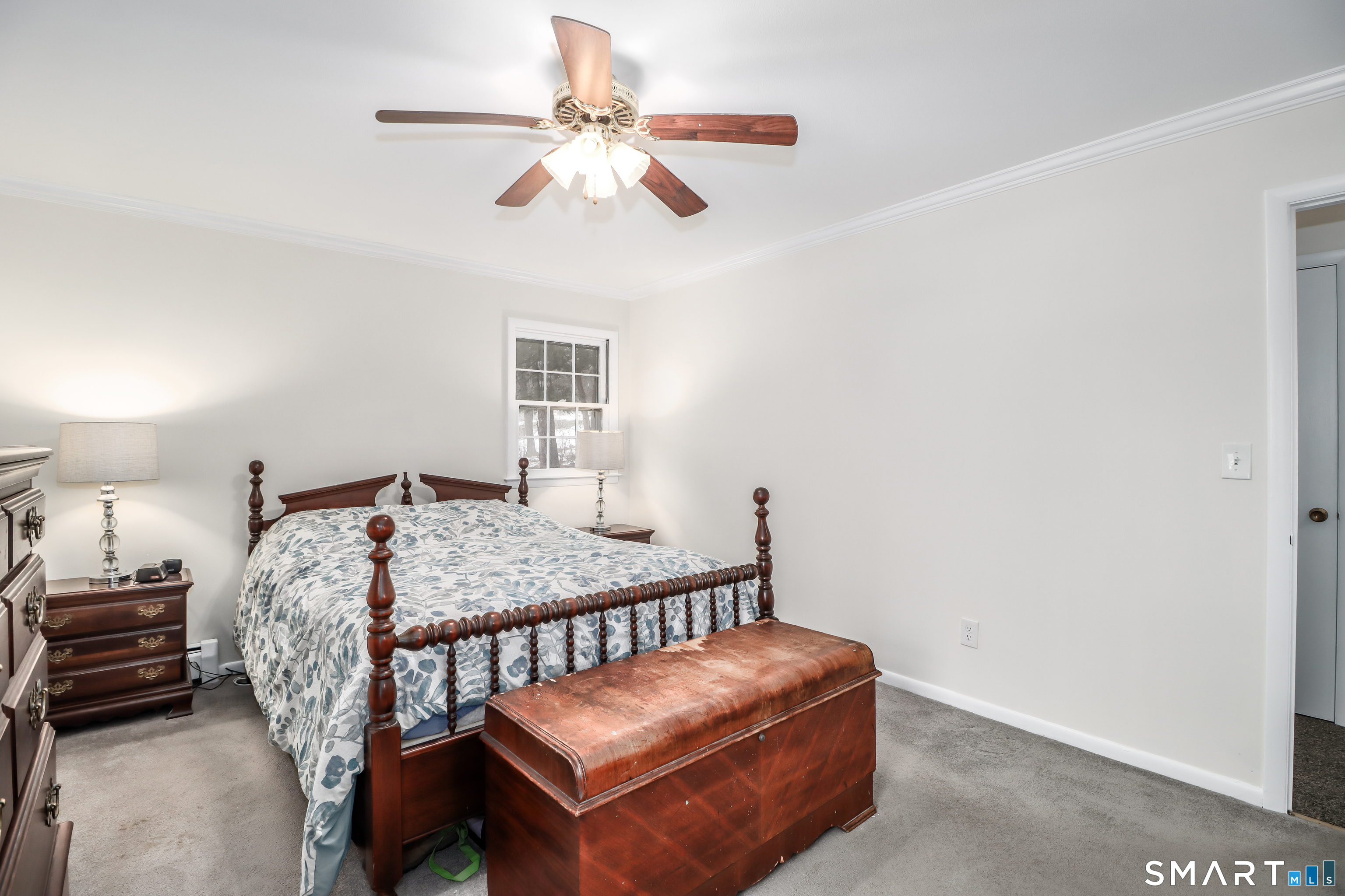 24 Prospect Drive Brookfield, CT 06804 - Photo 17 of 35 a bedroom with furniture and a chandelier