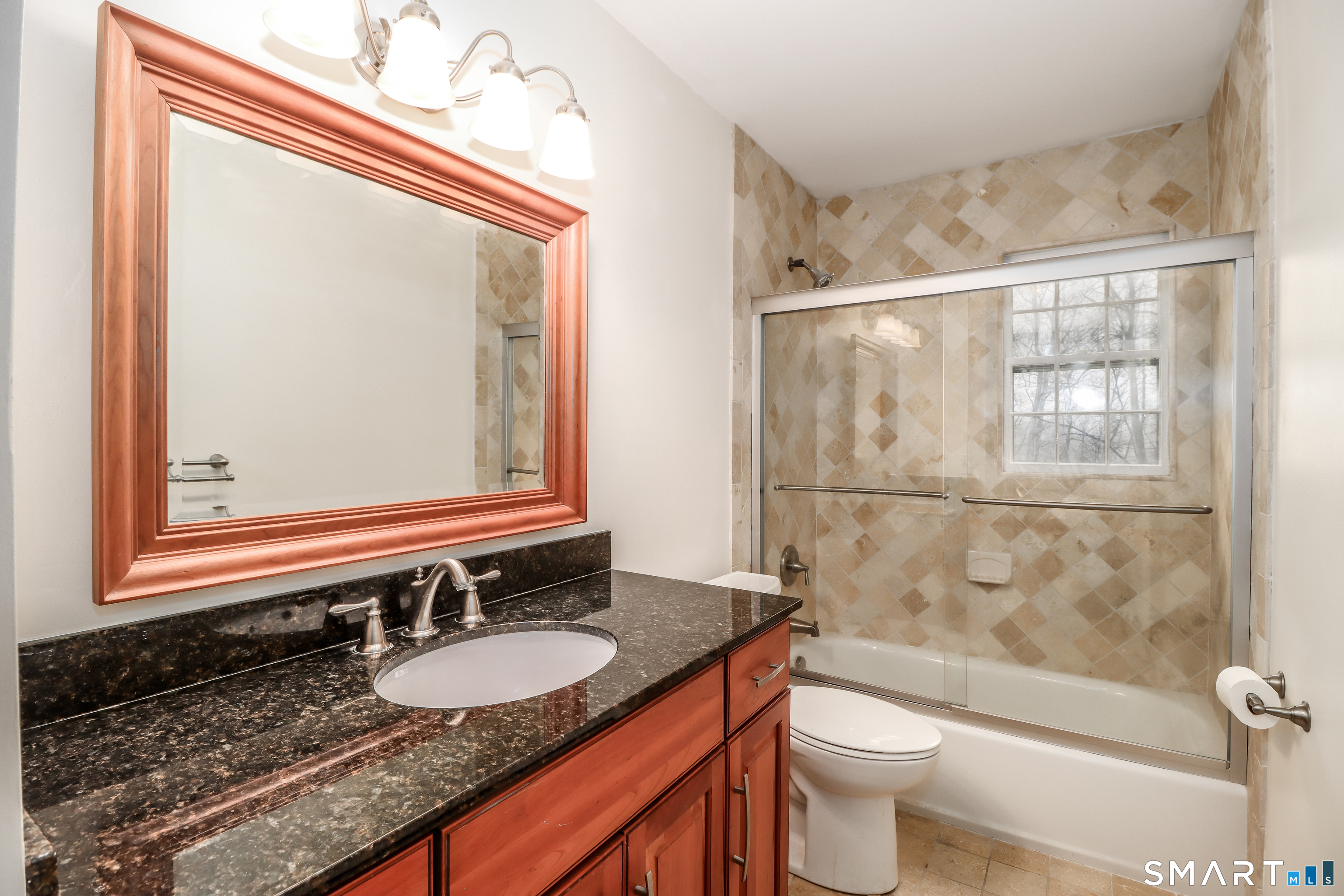 24 Prospect Drive Brookfield, CT 06804 - Photo 19 of 35 a bathroom with a granite countertop sink toilet a mirror and shower