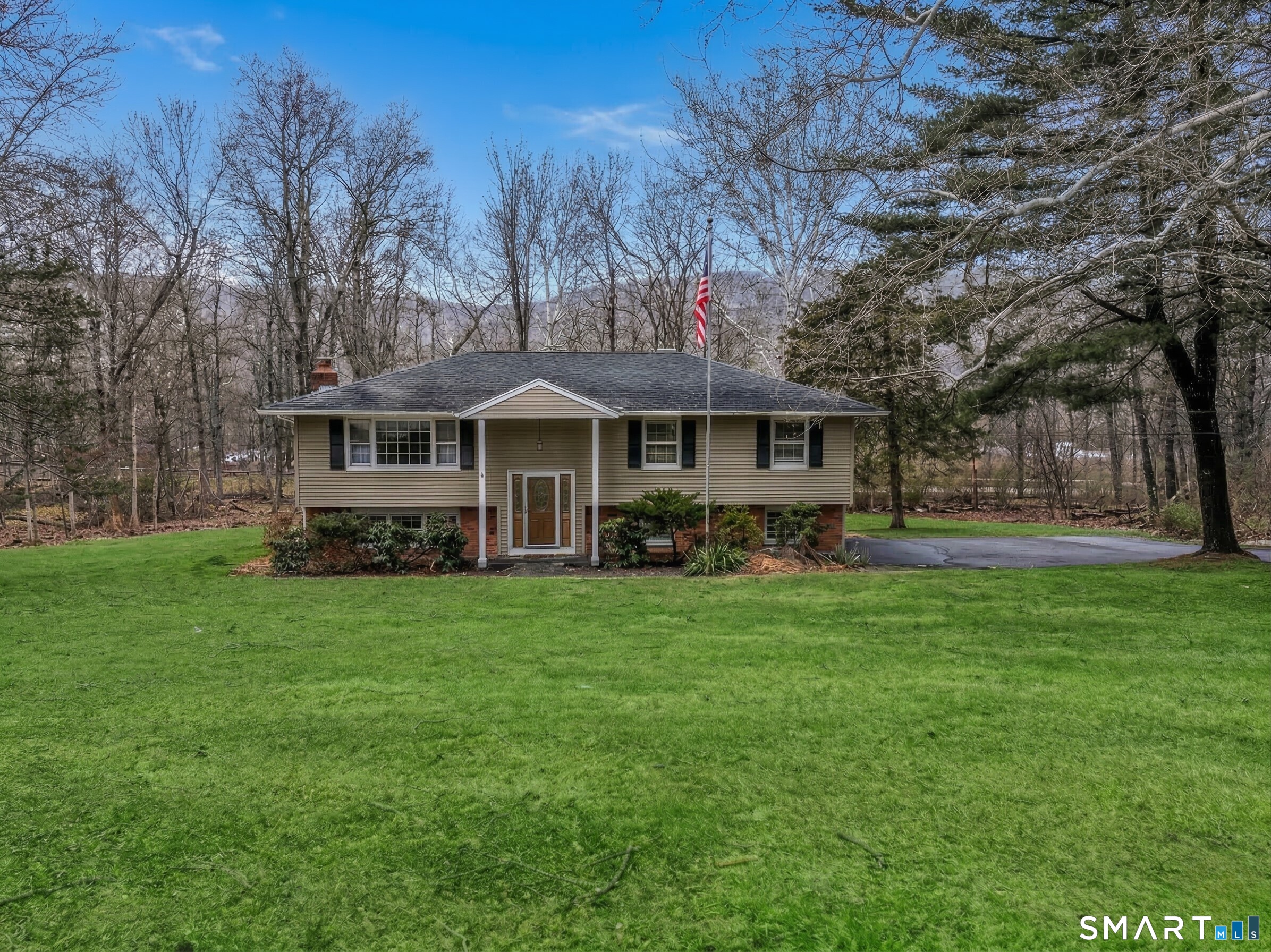 24 Prospect Drive Brookfield, CT 06804 - Photo 2 of 35 a front view of a house with a garden