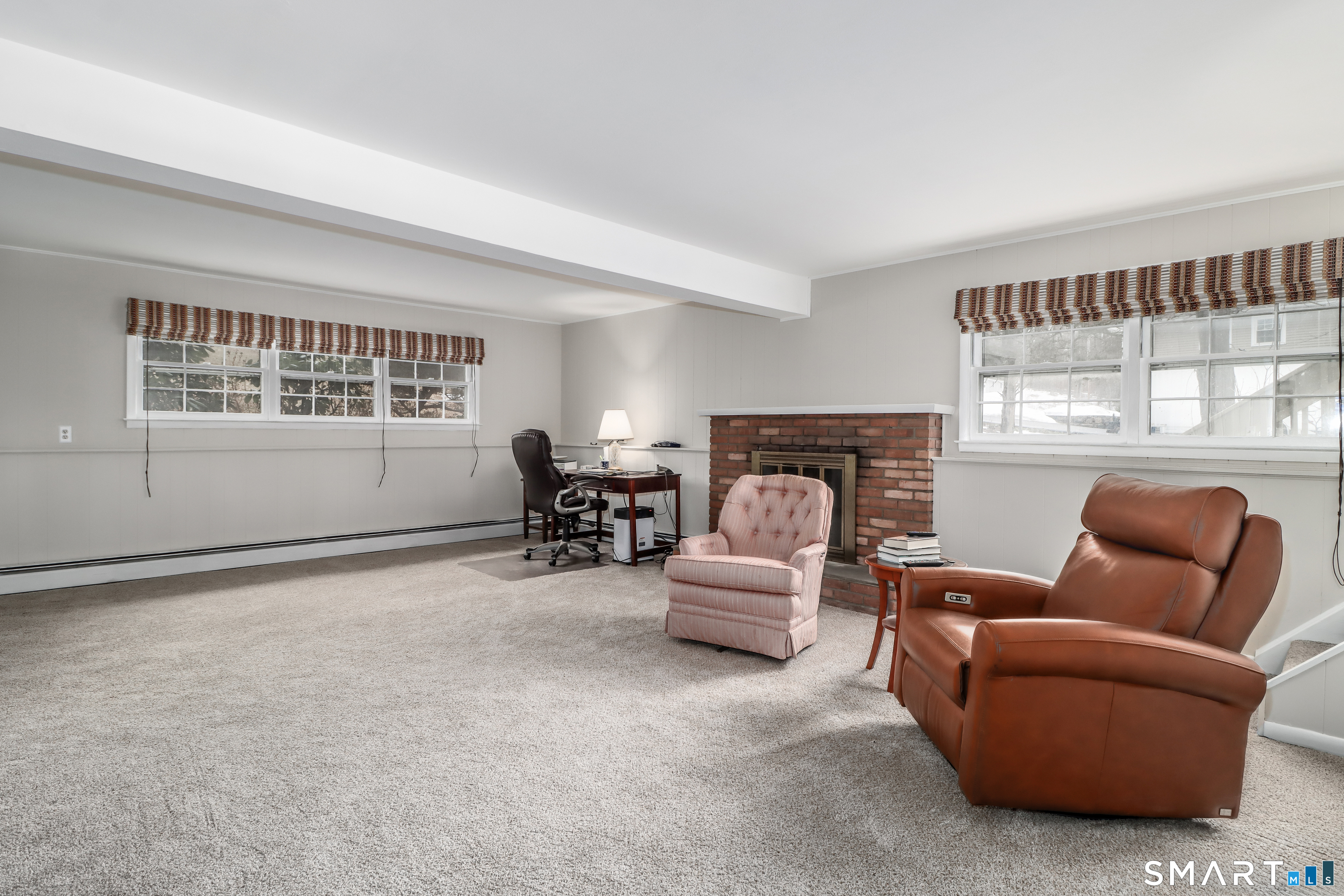 24 Prospect Drive Brookfield, CT 06804 - Photo 24 of 35 a living room with furniture and a fireplace