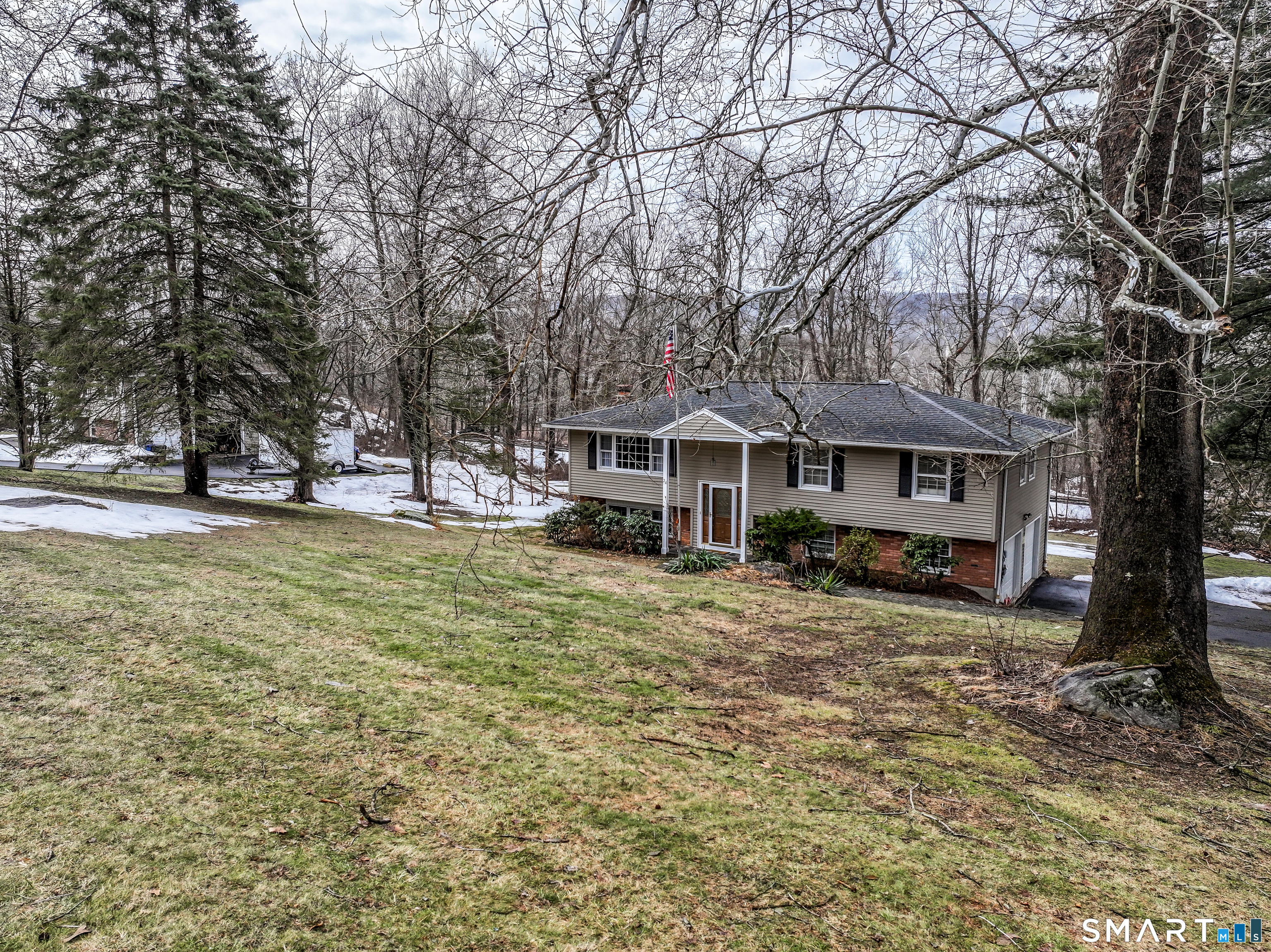 24 Prospect Drive Brookfield, CT 06804 - Photo 29 of 35 a front view of a house with a yard