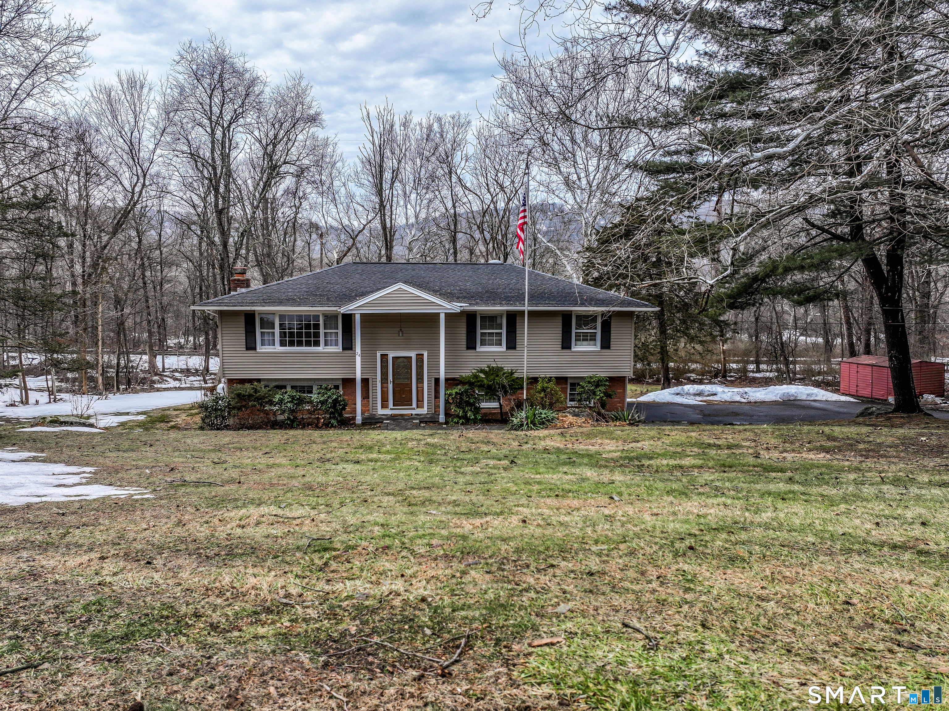 24 Prospect Drive Brookfield, CT 06804 - Photo 3 of 35 a front view of a house with a yard