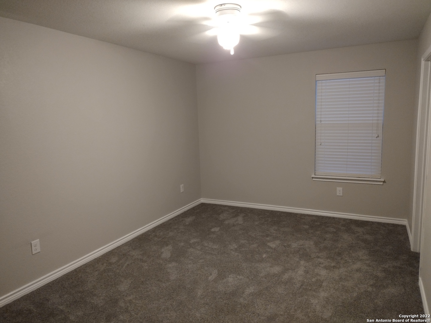 11212 Hill Top Loop Helotes, TX 78023 - Photo 25 of 34 an empty room with a window