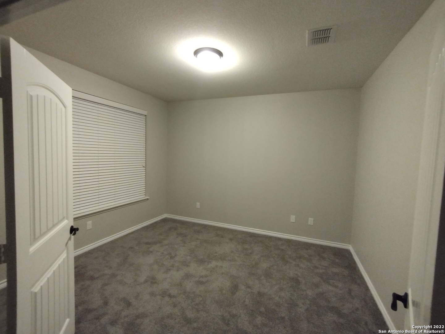 11212 Hill Top Loop Helotes, TX 78023 - Photo 30 of 34 an empty room with a empty space and windows