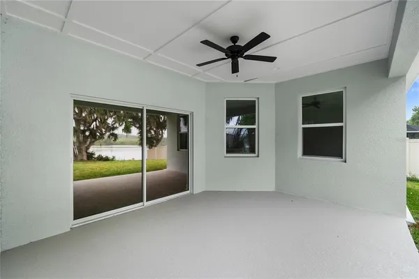 a view of a livingroom with a ceiling fan and window