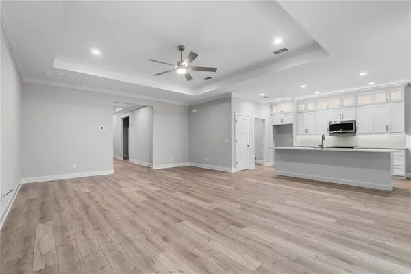 a view of kitchen with wooden floor and window