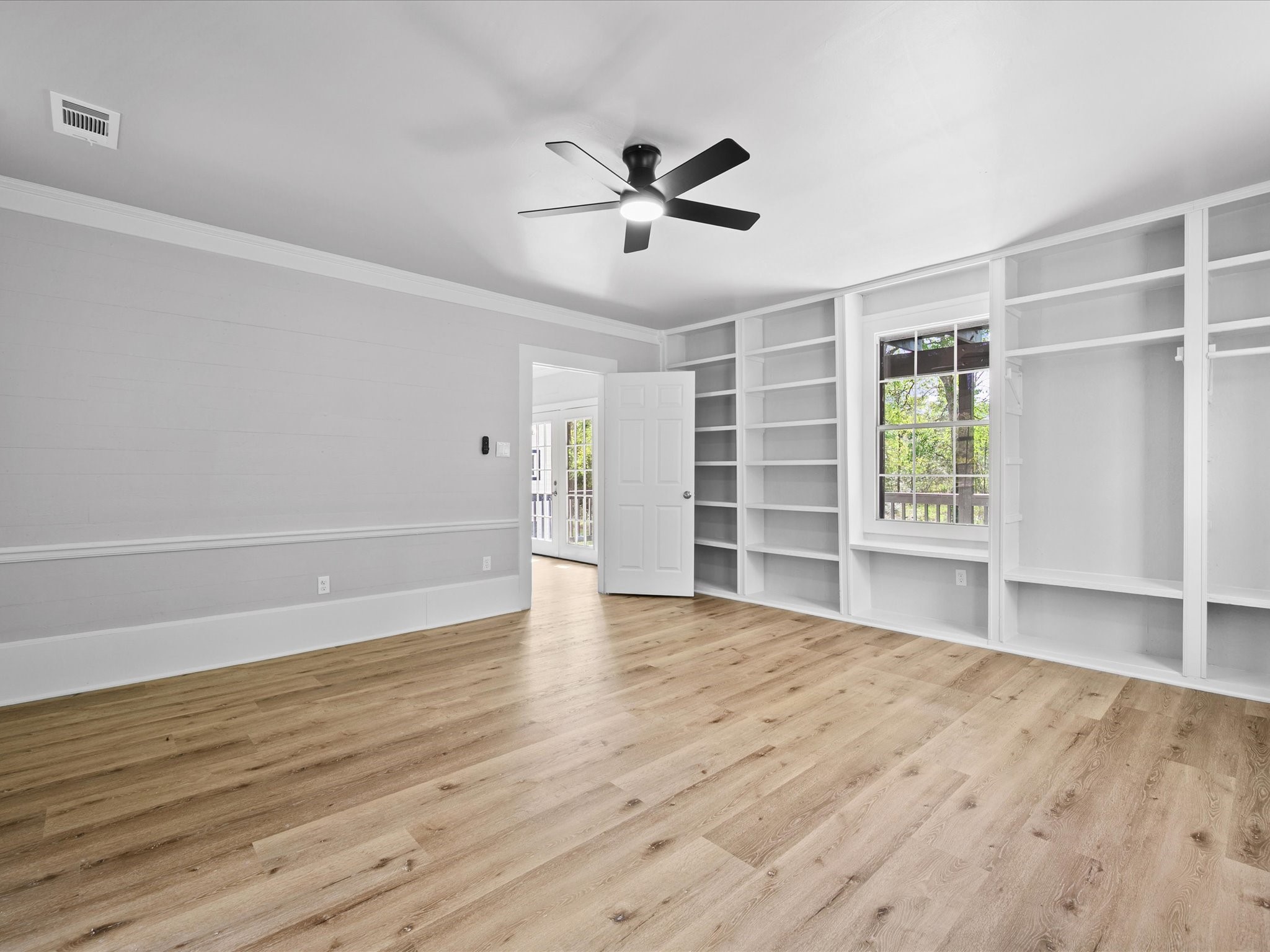 16958 Cedar Road Plantersville, TX 77363 - Photo 18 of 38 wooden floor in an empty room with a window