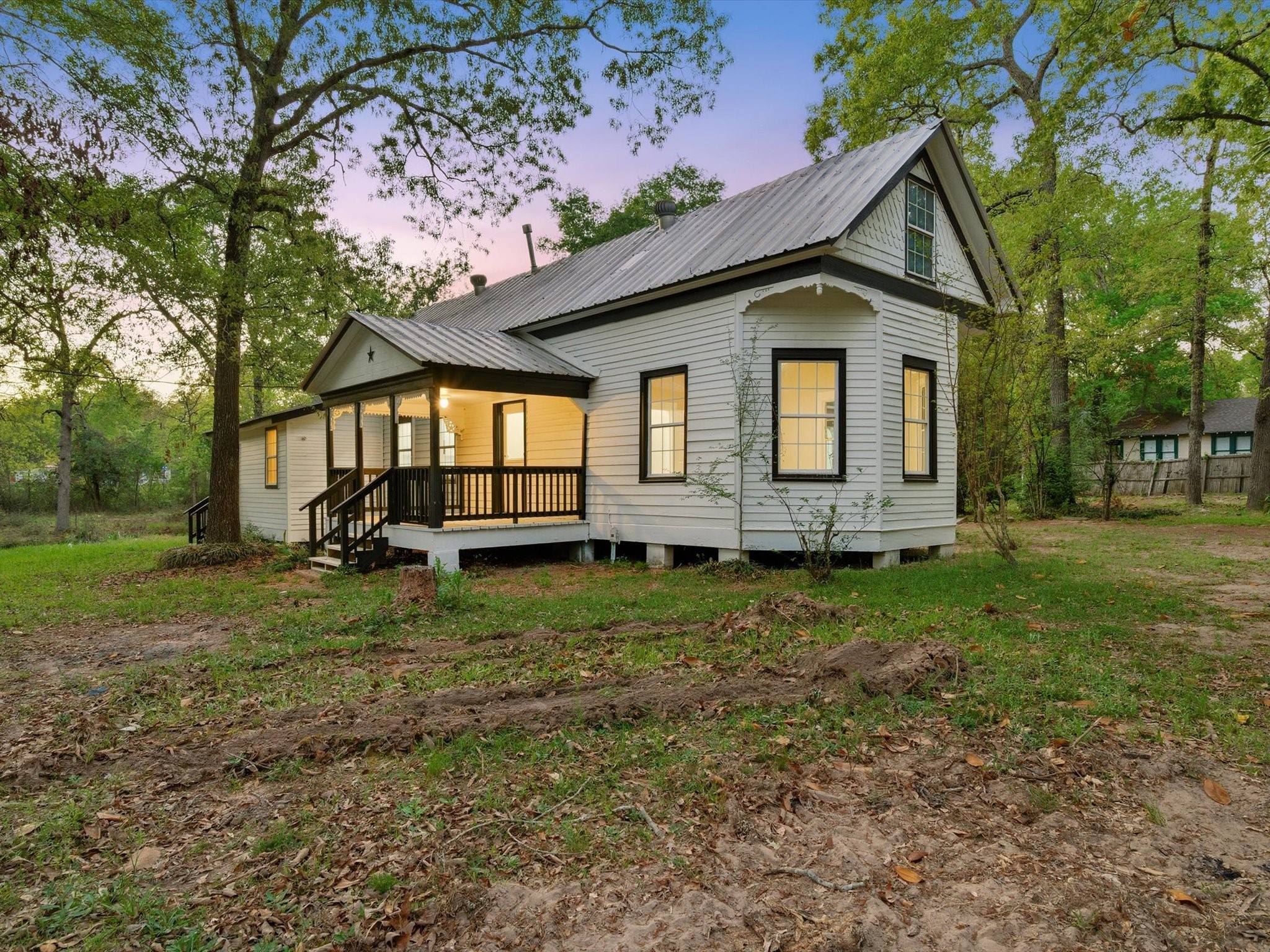 16958 Cedar Road Plantersville, TX 77363 - Photo 2 of 38 a front view of a house with garden